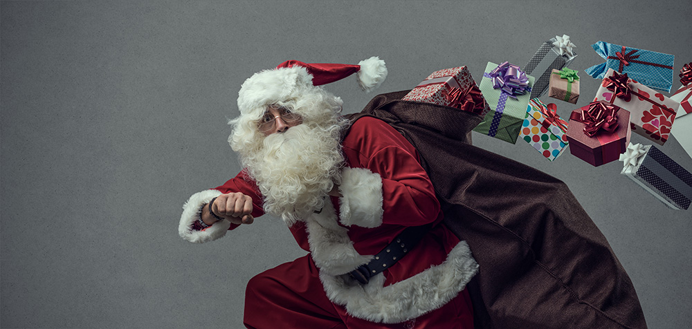 Funny Santa Claus running and delivering Christmas presents, he is checking time and losing gifts from his sack